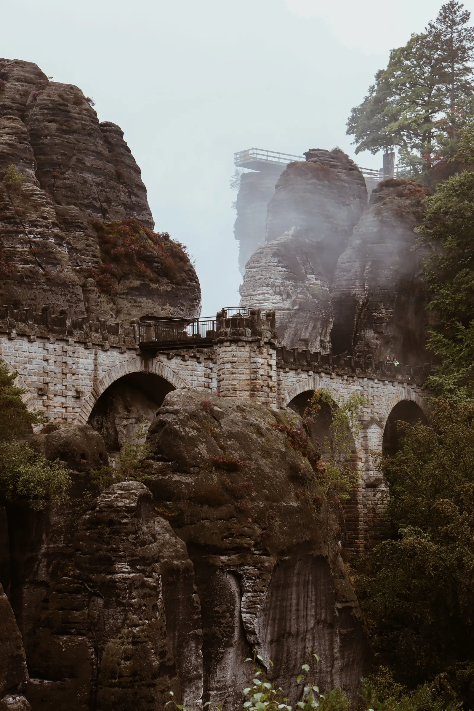 The Bastei Bridge among misty sandstone rock formations in Saxon Switzerland, Germany