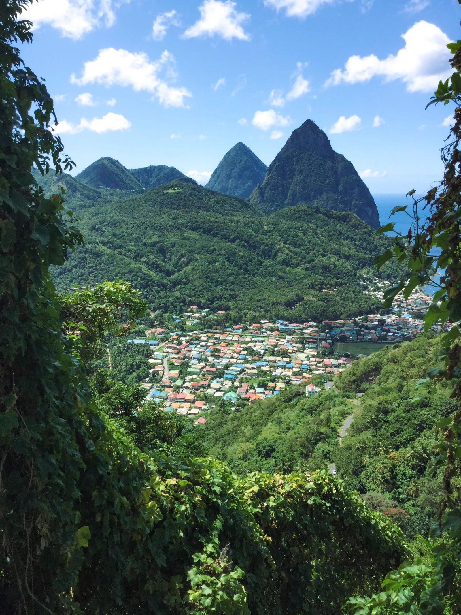 The Pitons rising above the colorful town of Soufrière, Saint Lucia