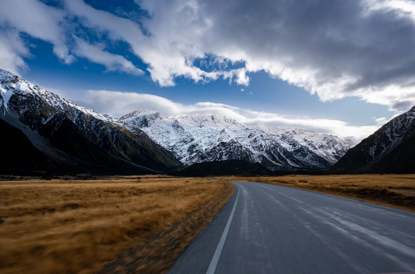 Road leading toward Aoraki Mount Cook and the Southern Alps in New Zealand