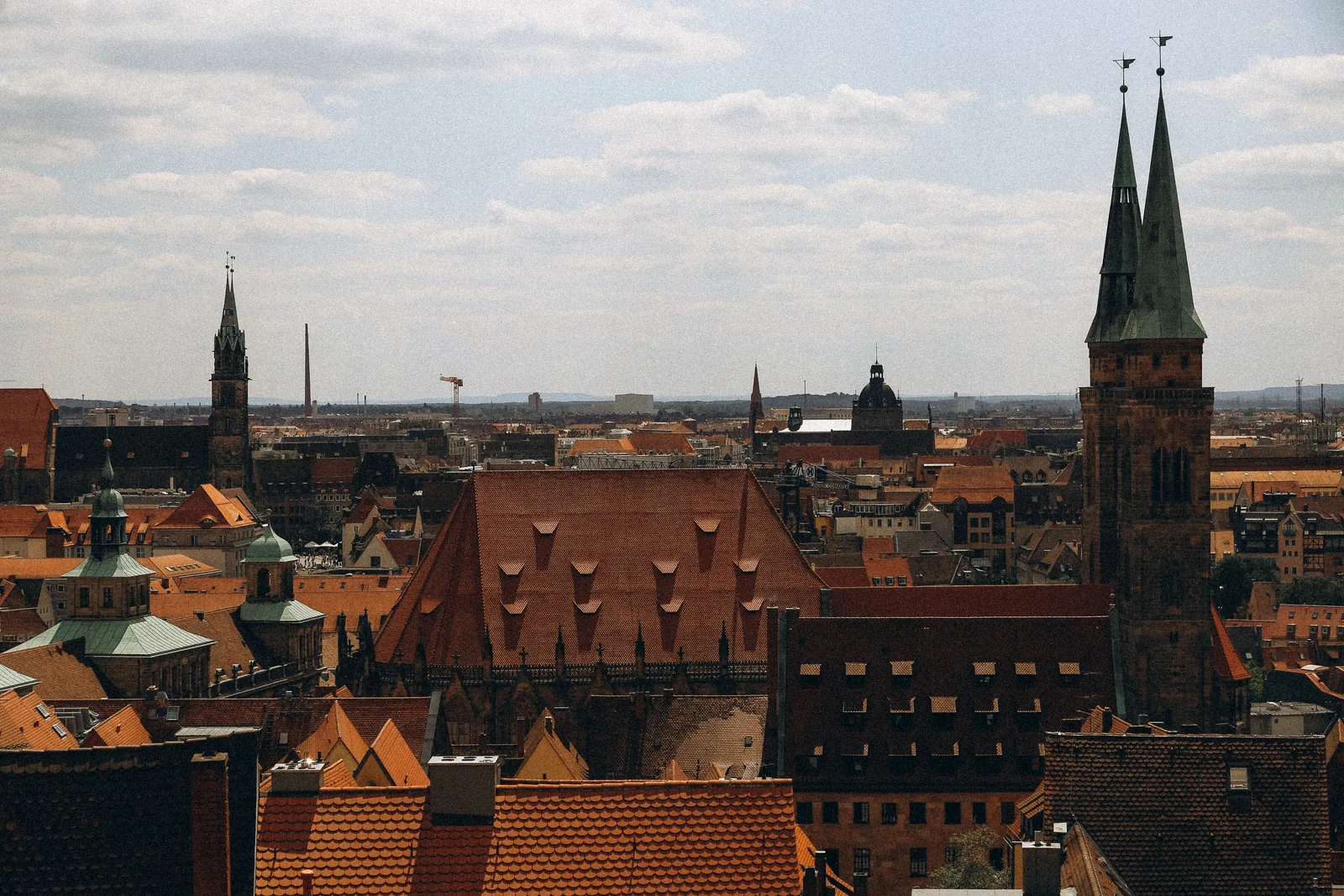 Panoramic view across the historic rooftops and church towers of Nuremberg Old Town