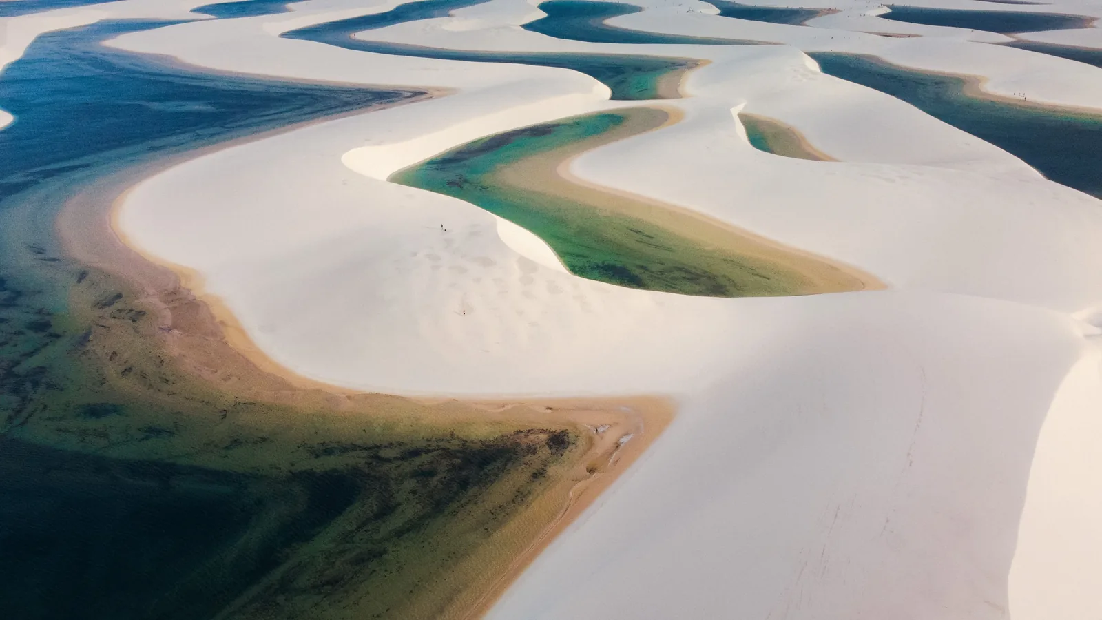 Aerial view of white sand dunes and turquoise lagoons in Lençóis Maranhenses National Park, Brazil
