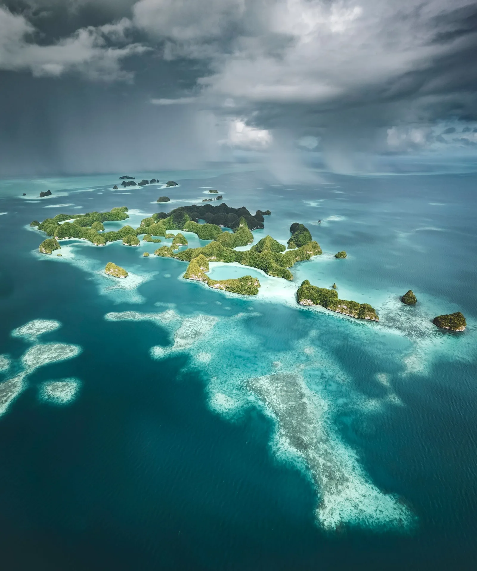 Aerial view of jungle-covered islands in turquoise water, Palau