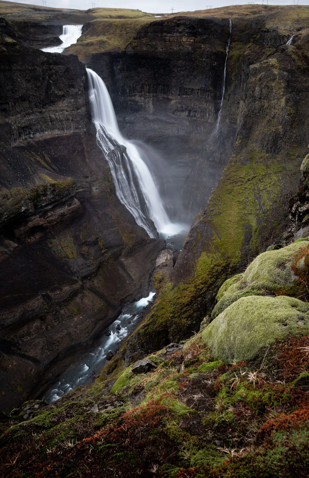 Waterfall and moss-covered canyon in Iceland