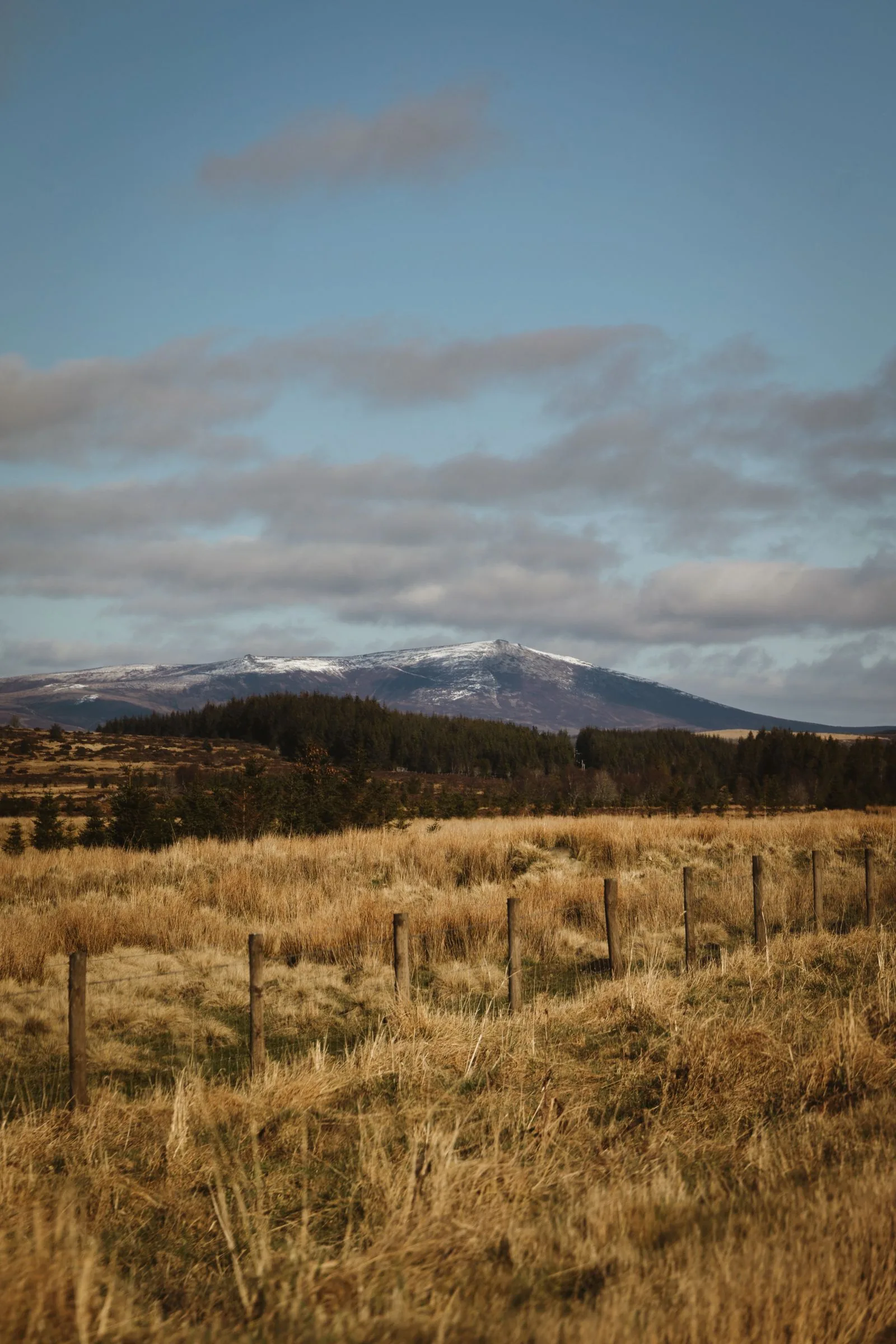 Snow-capped mountains and open landscape in the Scottish Highlands