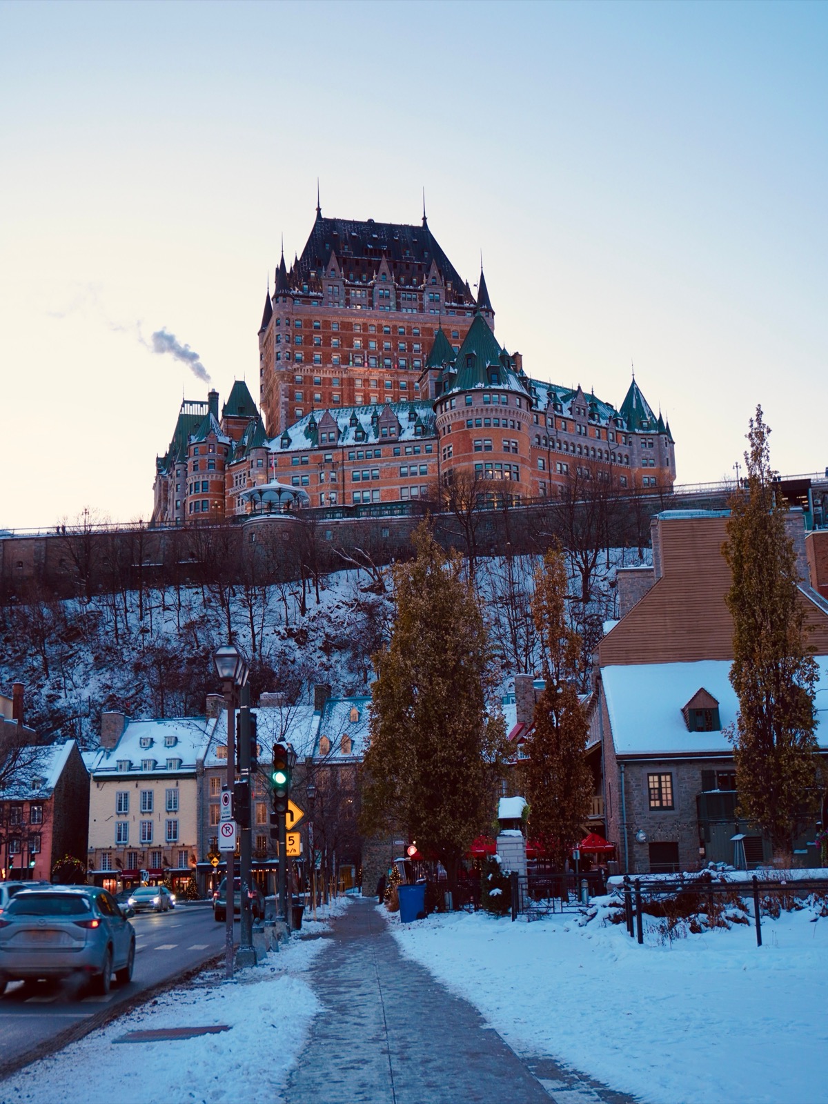 Château Frontenac above the snowy streets of Old Quebec at dusk