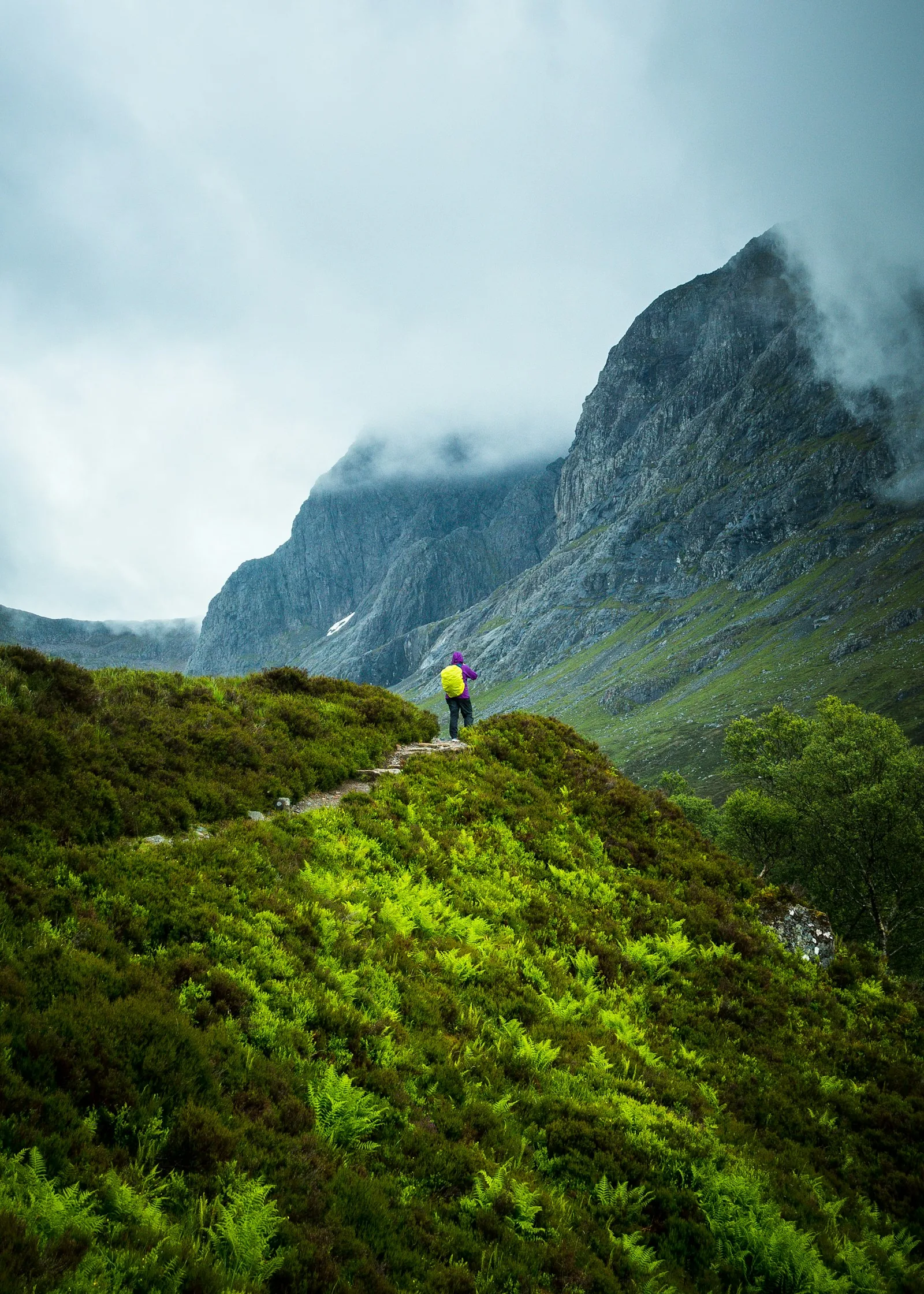 A solo hiker below the North Face of Ben Nevis in the Scottish Highlands